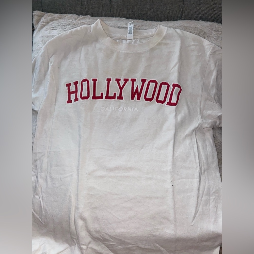 White T-Shirt with red lettering. Saying Hollywood California.